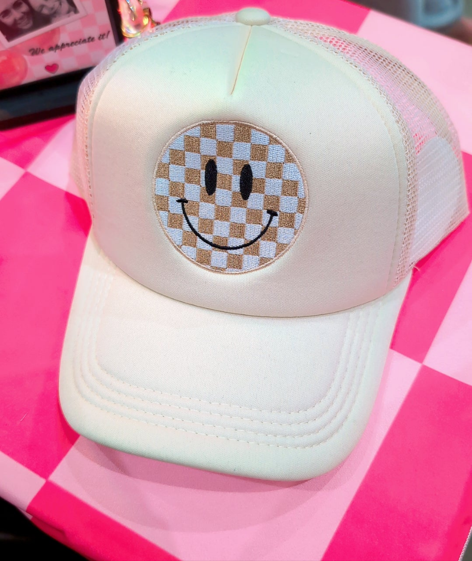 All smiles, trucker hat