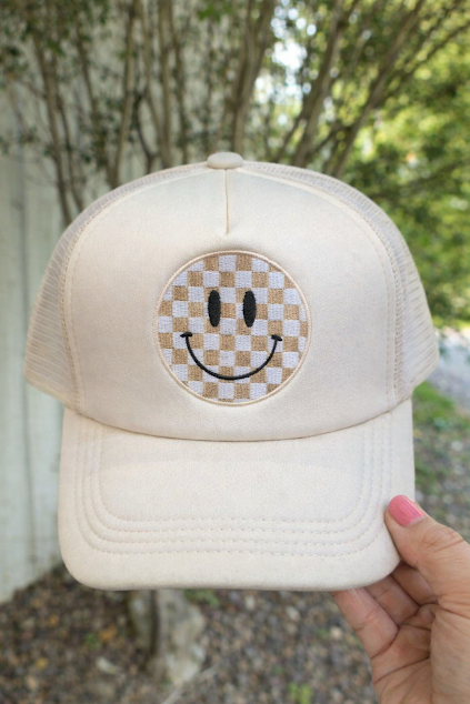 All smiles, trucker hat