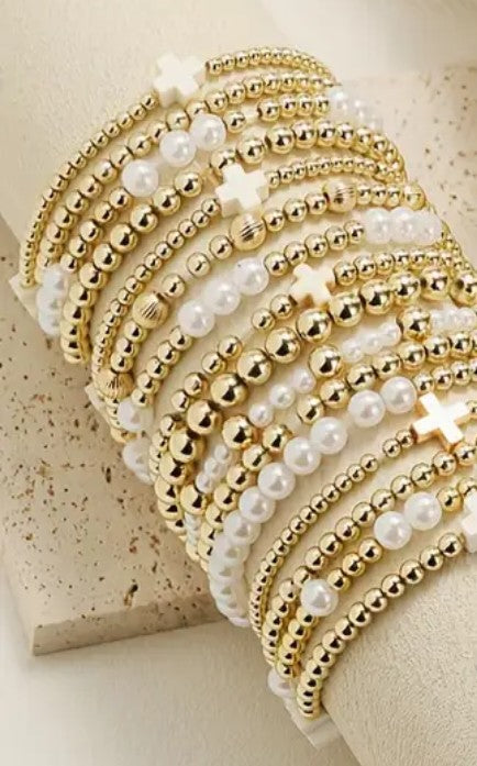 Set of 6 stretchy gold and Pearl cross bead bracelets