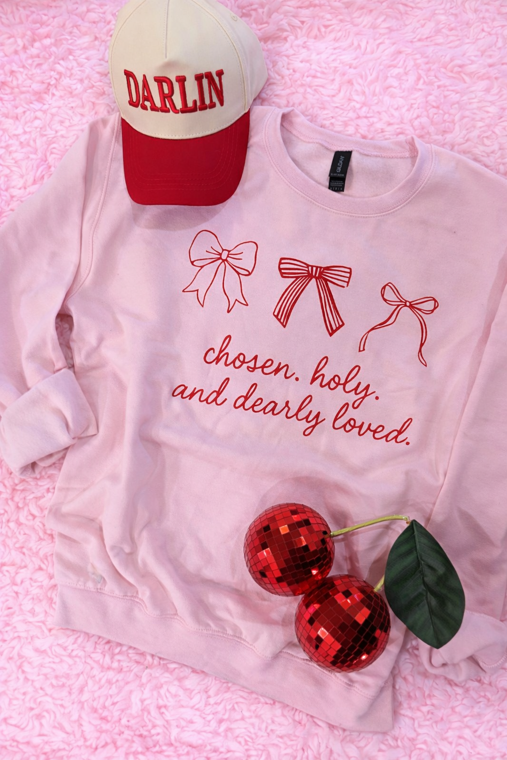 A pink chosen, holy, and dearly loved sweatshirt