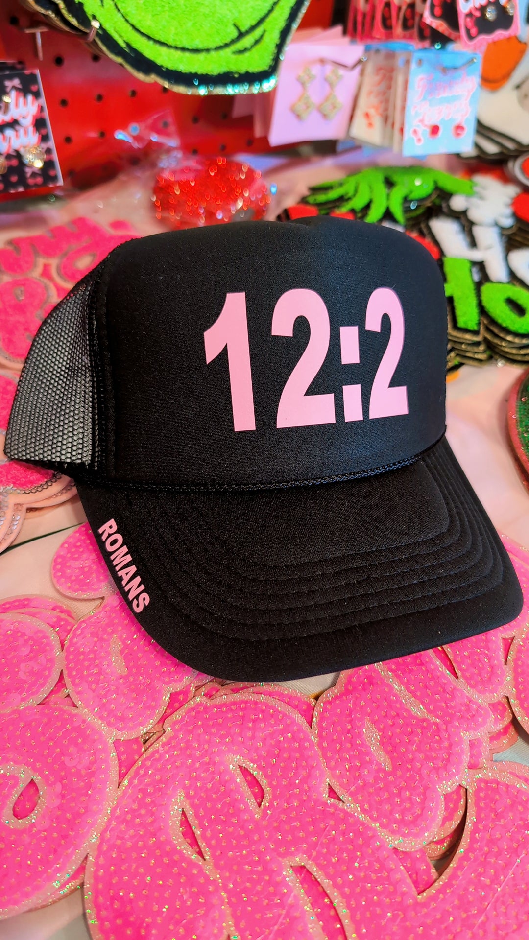 Romans 12:2 black and pink trucker hat