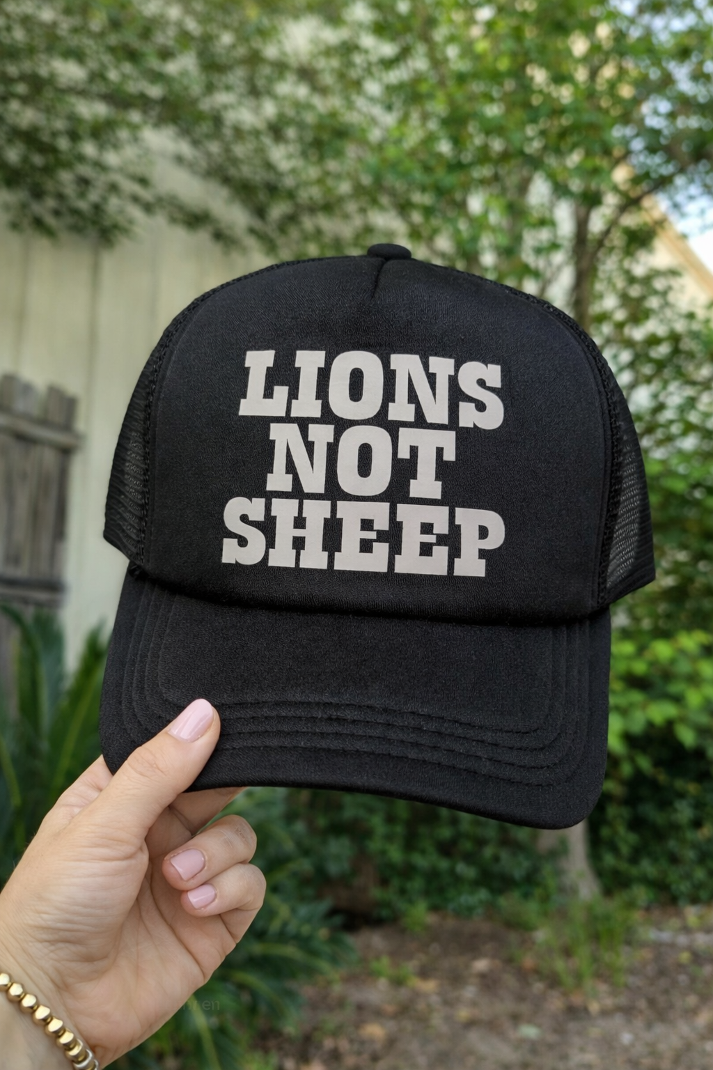 Lions not sheep black trucker hat