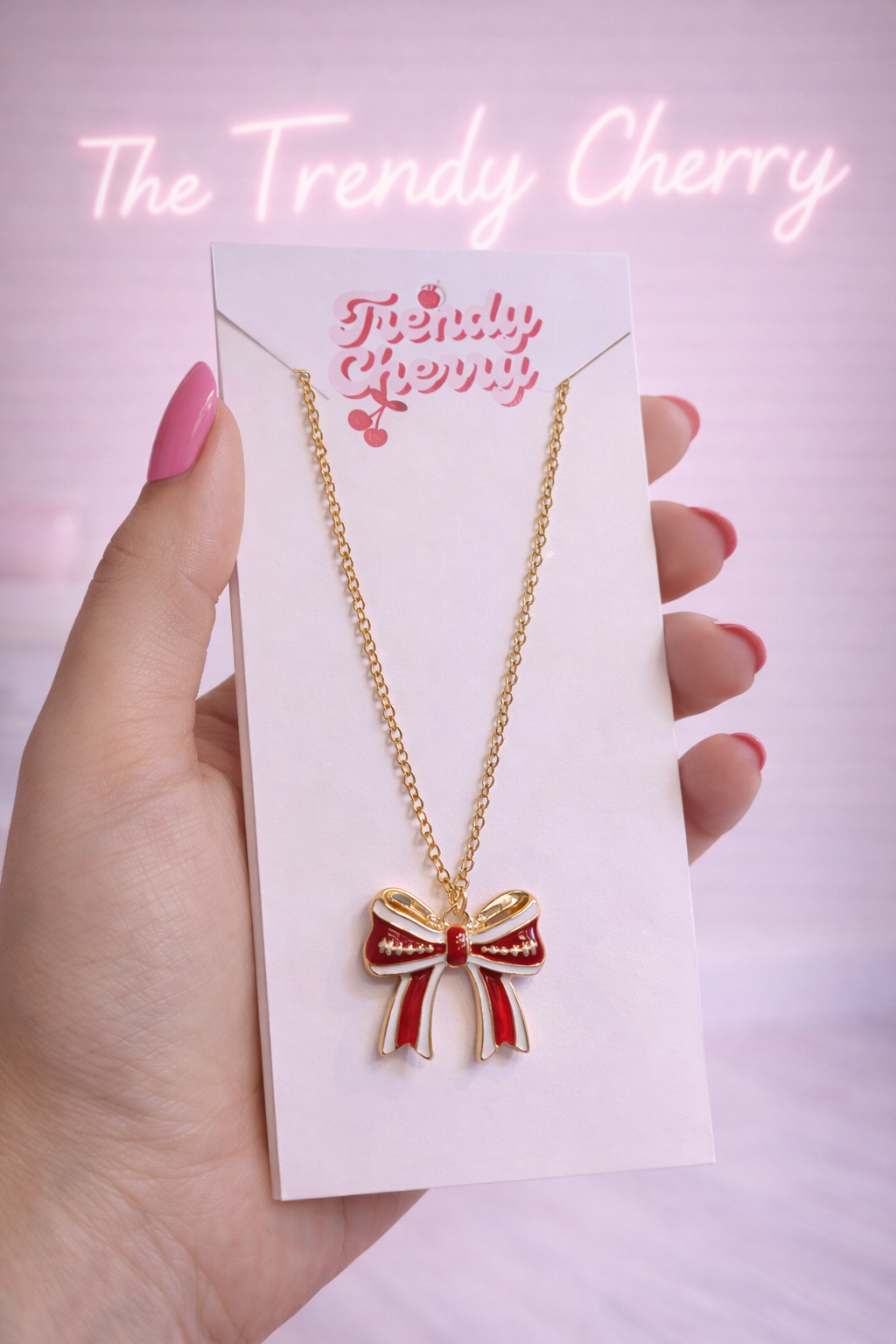Red and white gold bow necklace