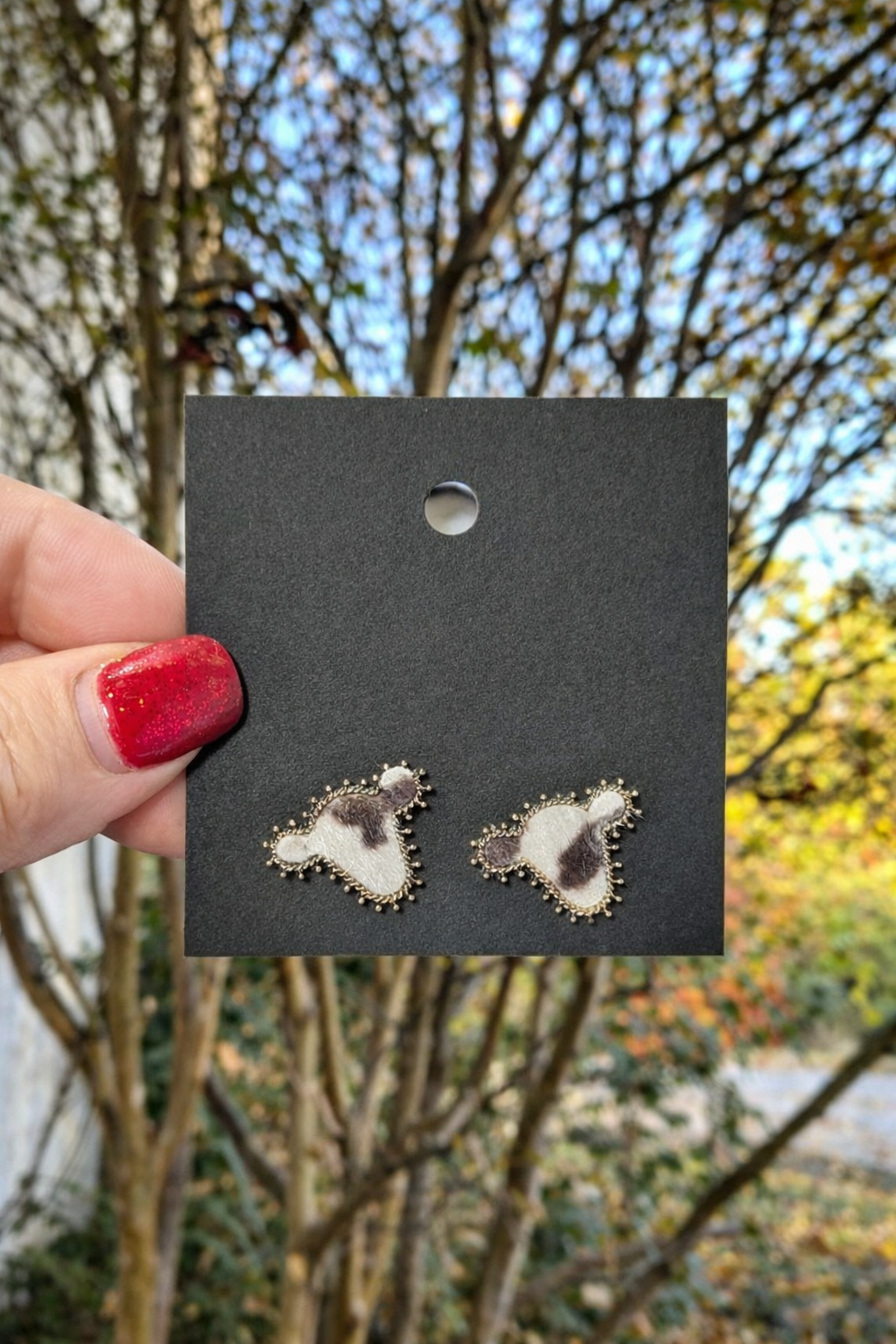 Faux cowhide stud earrings