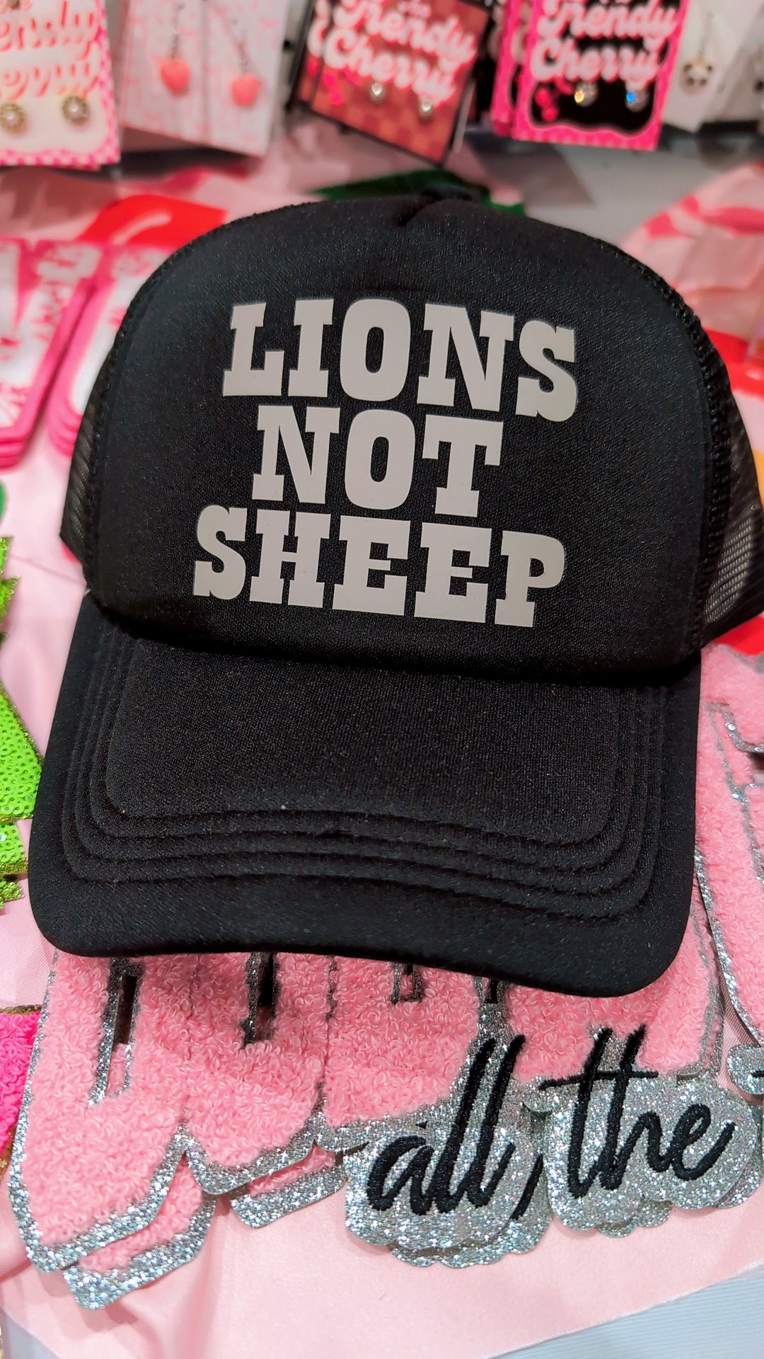 Lions not sheep black trucker hat