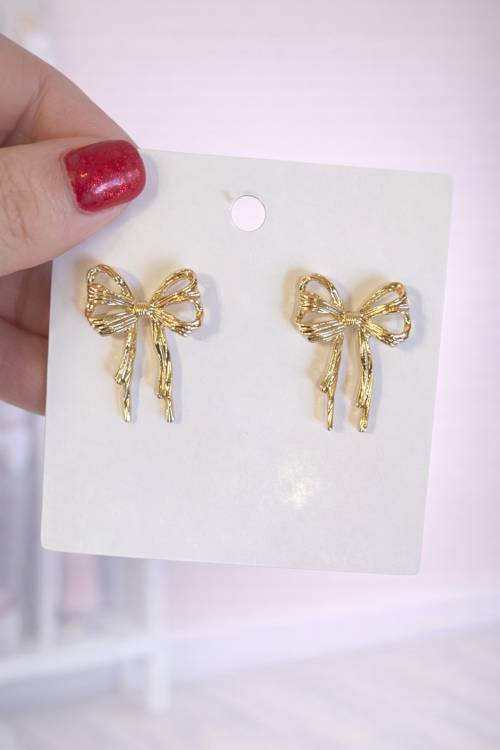 Wavy gold bow earrings